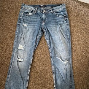 Distressed silver jeans